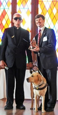 Father Pat with Golden Retriever Guide Dog