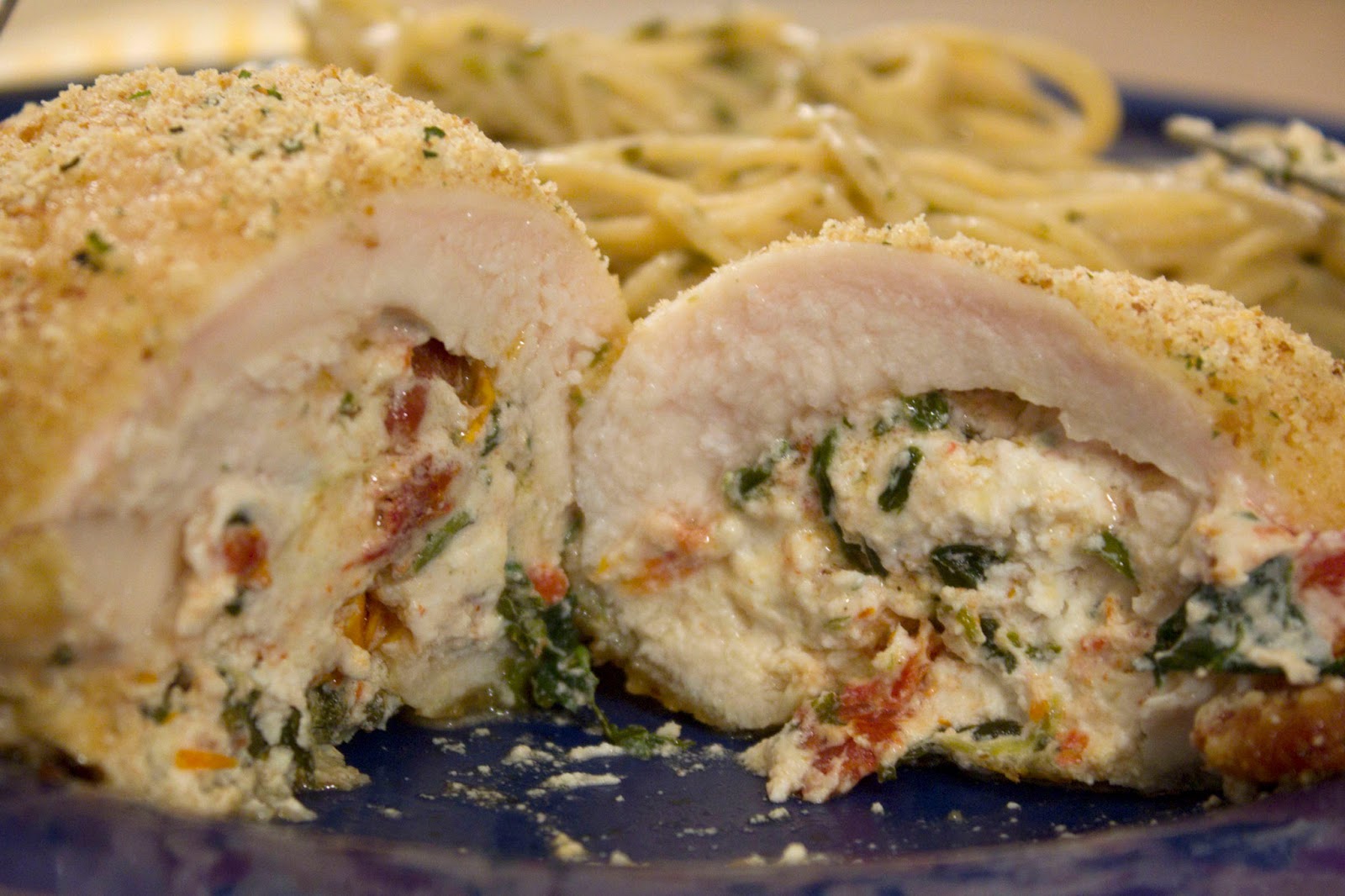 Munched Spinach, Sun Dried Tomato and Goat Cheese Stuffed Chicken