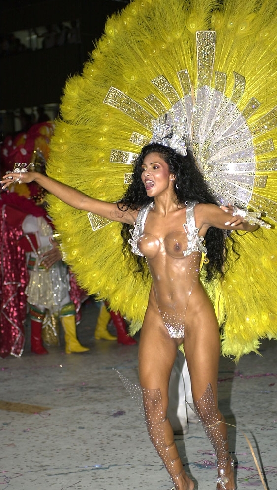The prettiest girl in Carnival. She's wearing a plexiglas outfit. After parading a few years at Unidos da Tijuca Samba-School, Fábia Borges was invited to become the Carnival Drum Queen for the Academics da Rocinha Samba-school, where she has supported since 2006.