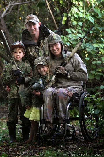 L-R: Charlie Wenley, 6, son of Dave Wenley; Georgia Smyth, 5, daughter of Sally Wenley (Dave's sister), a paraplegic in a wheelchair - dressed and armed ready for the start of duckshooting season. L-R: Charlie Wenley, 6, son of Dave Wenley; Georgia Smyth, 5, daughter of Sally Wenley (Dave's sister), a paraplegic in a wheelchair - dressed and armed ready for the start of duckshooting season. photograph