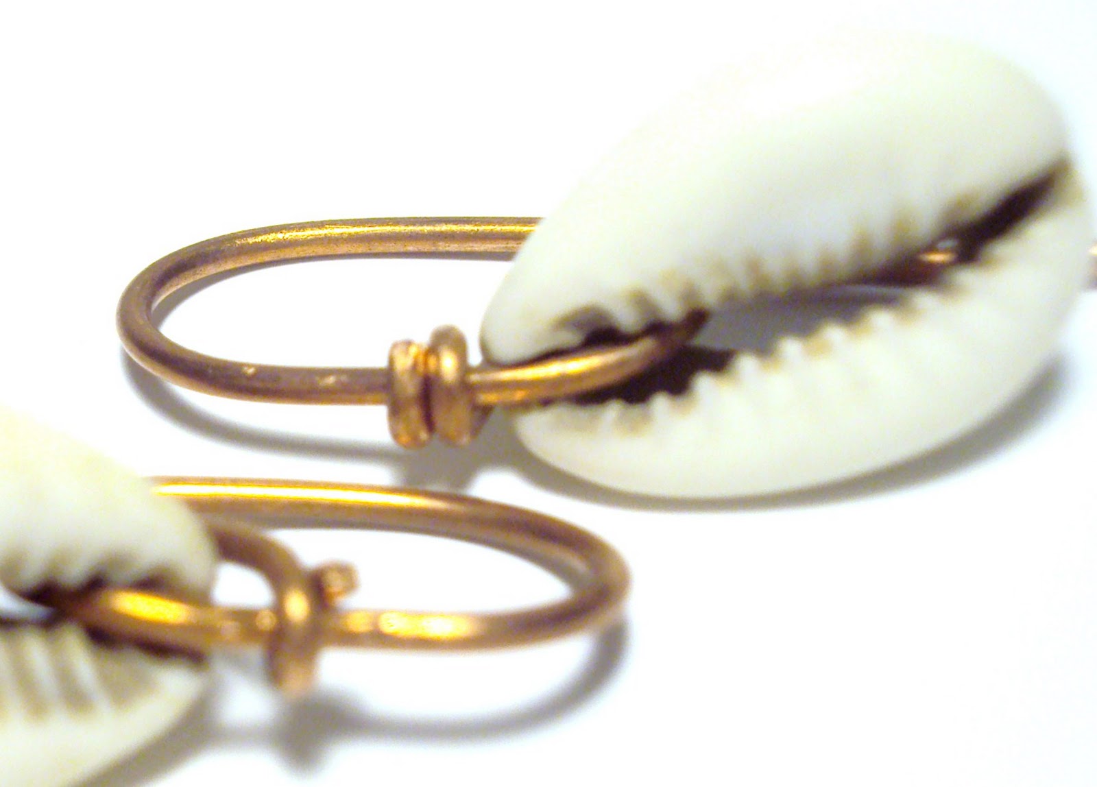 Playing With Copper Cowrie Shell Ear Spears