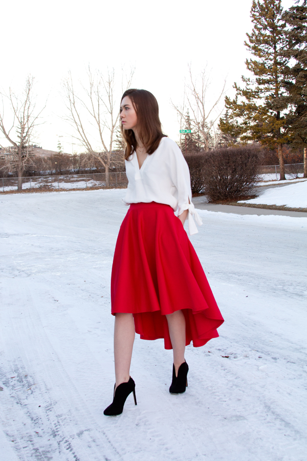 holiday outfit, holiday style, scuba skirt, christmas outfit, hi lo skirt, asymmetric skirt, nine west nero booties, bow blouse, bow sleeves