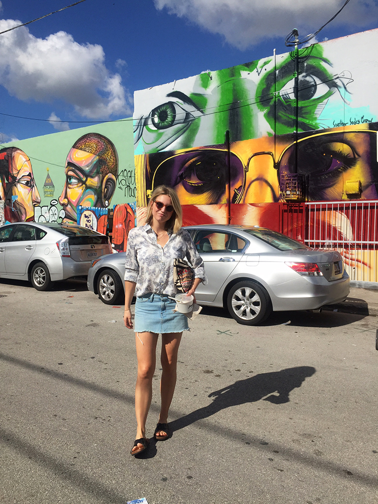 Fashion Over Reason in Wynwood, Miami, Raen Arkin sunglasses, Ann Taylor blouse, Gap denim cutoff skirt, H&M slides, Zara clutch, street art mural