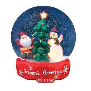 Christmas star,snowman, and Santa Claus with decorated X mas tree inside the snow globe photo with seasons greetings lettering image