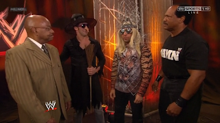 Zack Ryder dressed as a witch and Santino Marella dressed as Lady Gaga seen here along  with Teddy Long and Ron Simmons