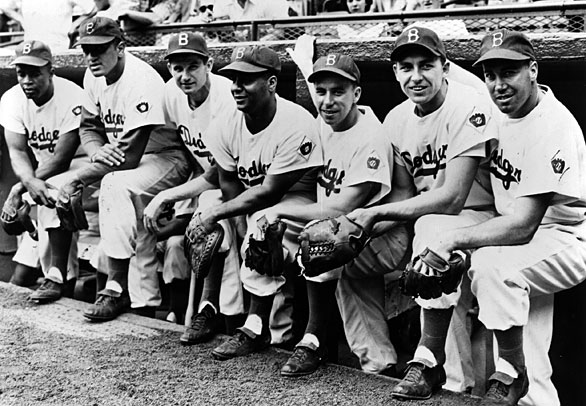 In Brooklyn's dugout: From left, Jackie Robinson, Don Newcombe, Preacher Roe, Roy Campanella, Pee Wee Reese, Gil Hodges and Duke Snider.
