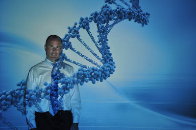 Dr. Todd Armstrong poses in a stand of DNA.