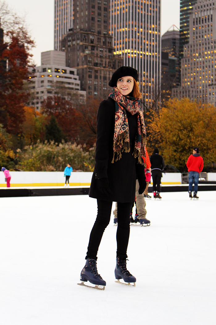 Ice skating in Central Park in fall. Fashion Blogger outfit with a beret.