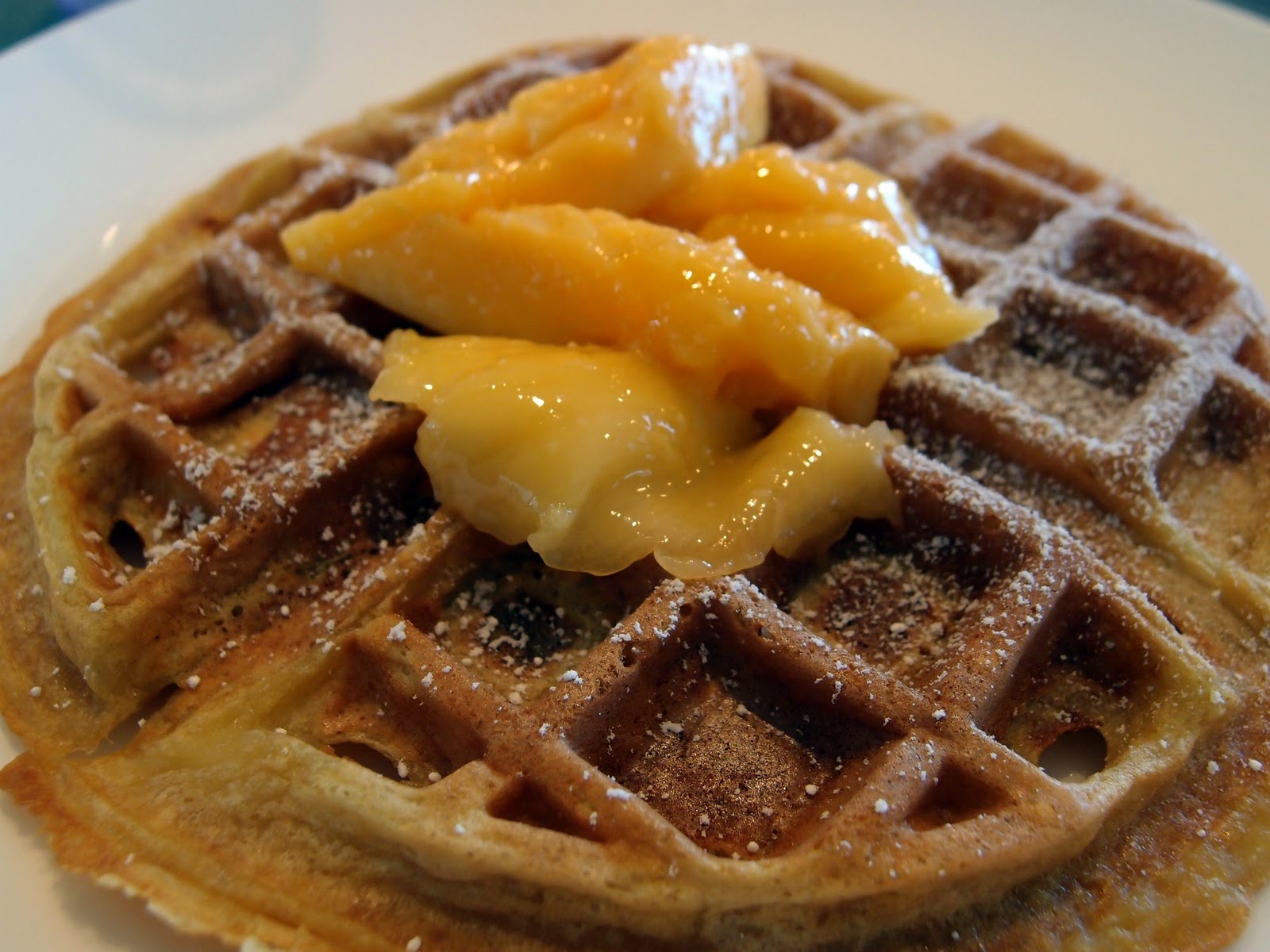 Milk and Honey Toasted Coconut Waffles with Fresh Mangoes and Palm Syrup