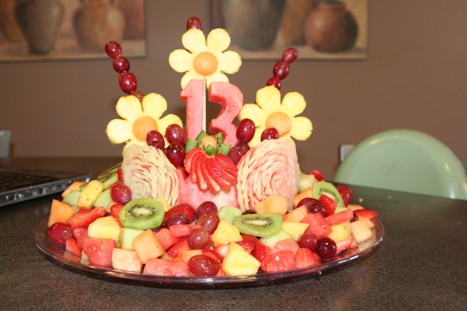 The Fruity Flower Girl Fruit Arrangements and Carvings