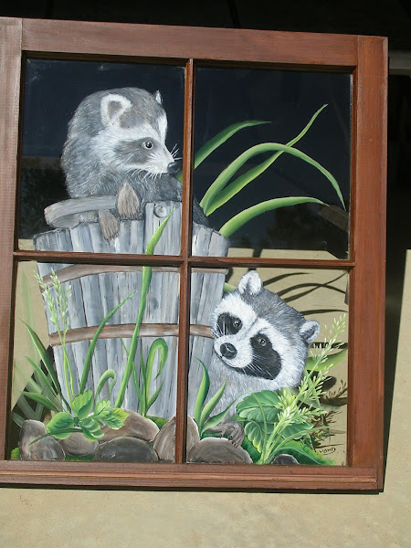 Raccoons on old window