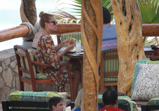 Lauren Conrad enjoys a hamburger on a balcony in Cabo San Lucas