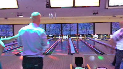 Person with back to camera getting ready to bowl