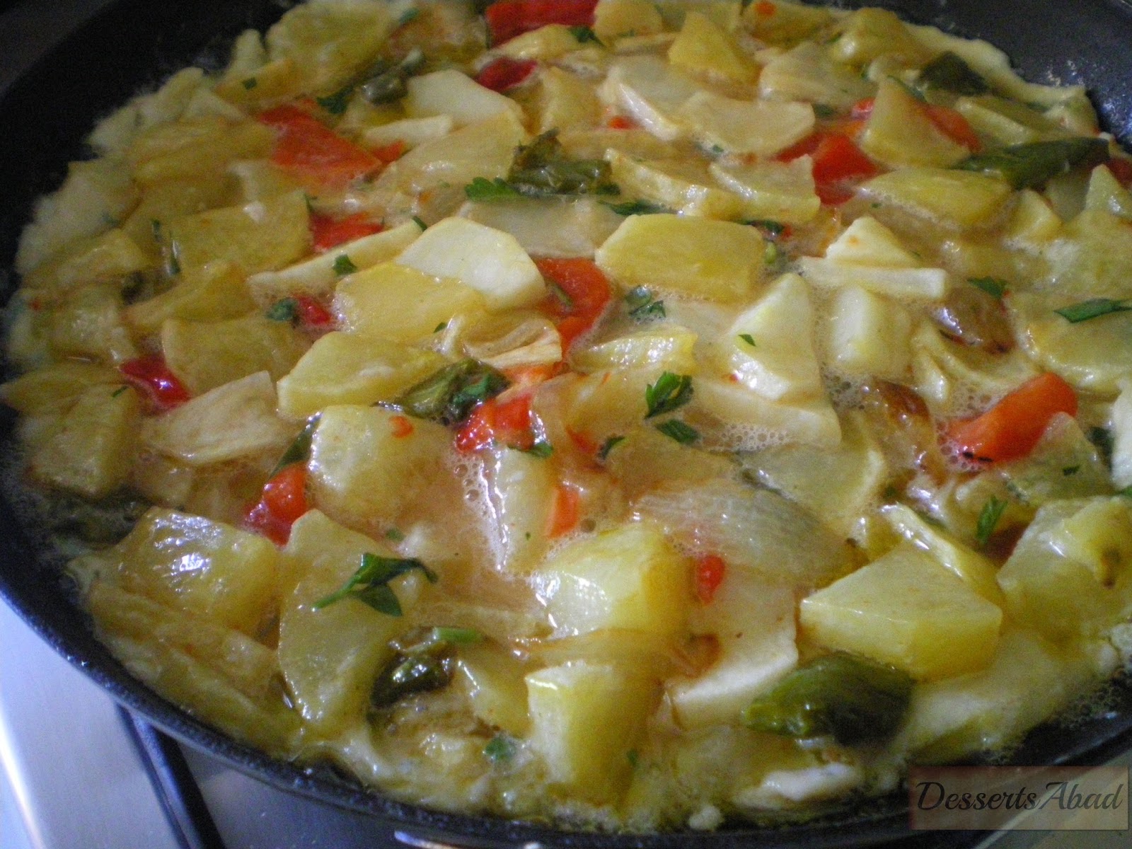 DessertsAbad Tortilla de patatas con cebollas y pimientos