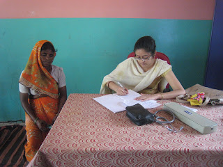 Two women at writing at a table