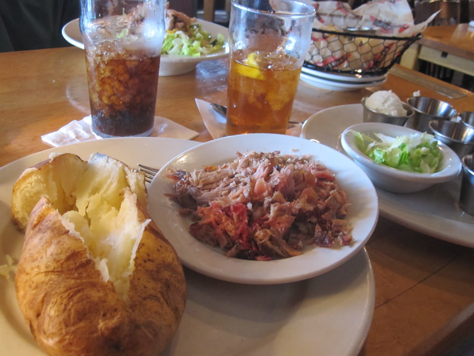 Man Up Tales of Texas BBQ™ Pulledpork potato at Jim 'N Nick's BarB