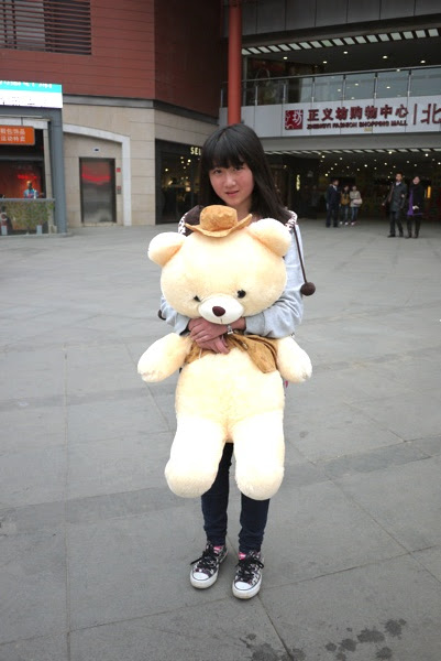 close up of the girl with her stuffed bear