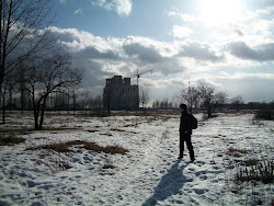 Chris in front of half built Russian Orthodox Church in the background.