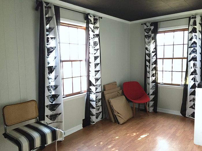 office with painted paneling, black ceiling tiles office with painted paneling, black ceiling tiles