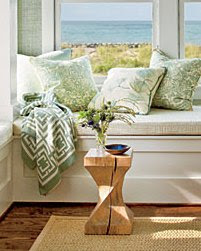 Close up of the Nbaynadamas throw in a window seat vignette with an ocean view in the Coastal Living Magazine