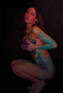 breast squeezing a woman's body paint