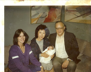 my adopted mom, bio dad, and birth mom, and I.
