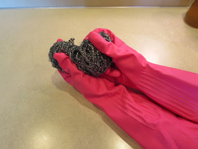 wear gloves and use steel wool to get glue residue off 