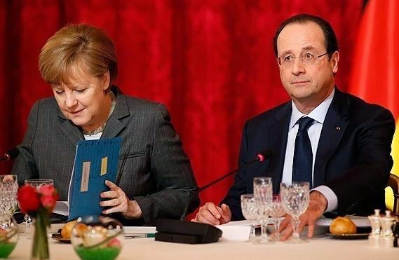 Μέρκελ και Ολάντ απειλούν τη Μόσχα με νέες κυρώσεις