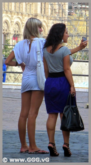 Blonde girl in white shirt on the street