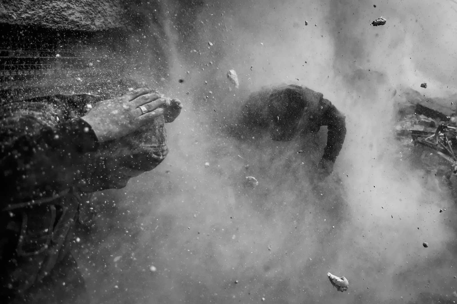 1st Prize Spot News Stories Goran Tomasevic, Serbia, Reuters 30 January 2013, Damascus, Syria Syrian rebel fighters take cover amid flying debris and shrapnel after being hit by a tank shell fired towards them by the Syrian Army in the Ain Tarma neighborhood of Damascus. On 30 January 2013, a Syrian rebel group planning an attack on government forces is hit by sniper fire in Damascus, Syria. After evacuating their comrade, who was shot in the chest and would later die from injuries, the rebels return to attack the checkpoint with rocket fire. Subsequently, government forces fired tank shells at the rebels. The rebels eventually retreated for the day to mourn the death of their comrade. world press photo, Goran Tomasevic