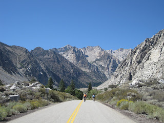 Two cyclists in the upper reaches of Pine Creek Road, near Bishop, California