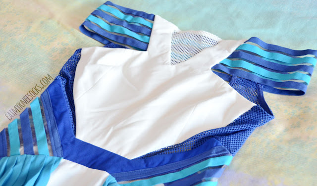 SheIn Fashion Review: Three Floor Ray of Light Dupe Dress SheIn's off-shoulder striped blue-and-white dress is a dupe of the Ray of Light dress by Three Floor, featuring mesh cutouts, pleated chiffon panels, and bright colors.