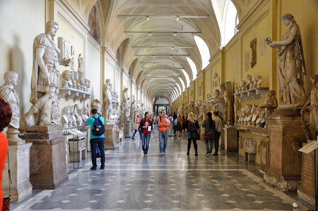 Corridor filled with statues and busts at the Vatican Museum Corridor filled with statues and busts at the Vatican Museum
