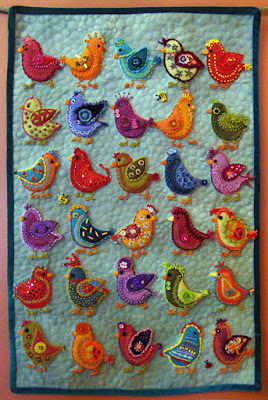 Chickadees, a wall quilt by Carrie Unick, embroidery on wool applique