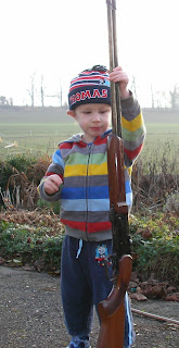over and under .410 shotgun and boy in thomas the tank engine hat