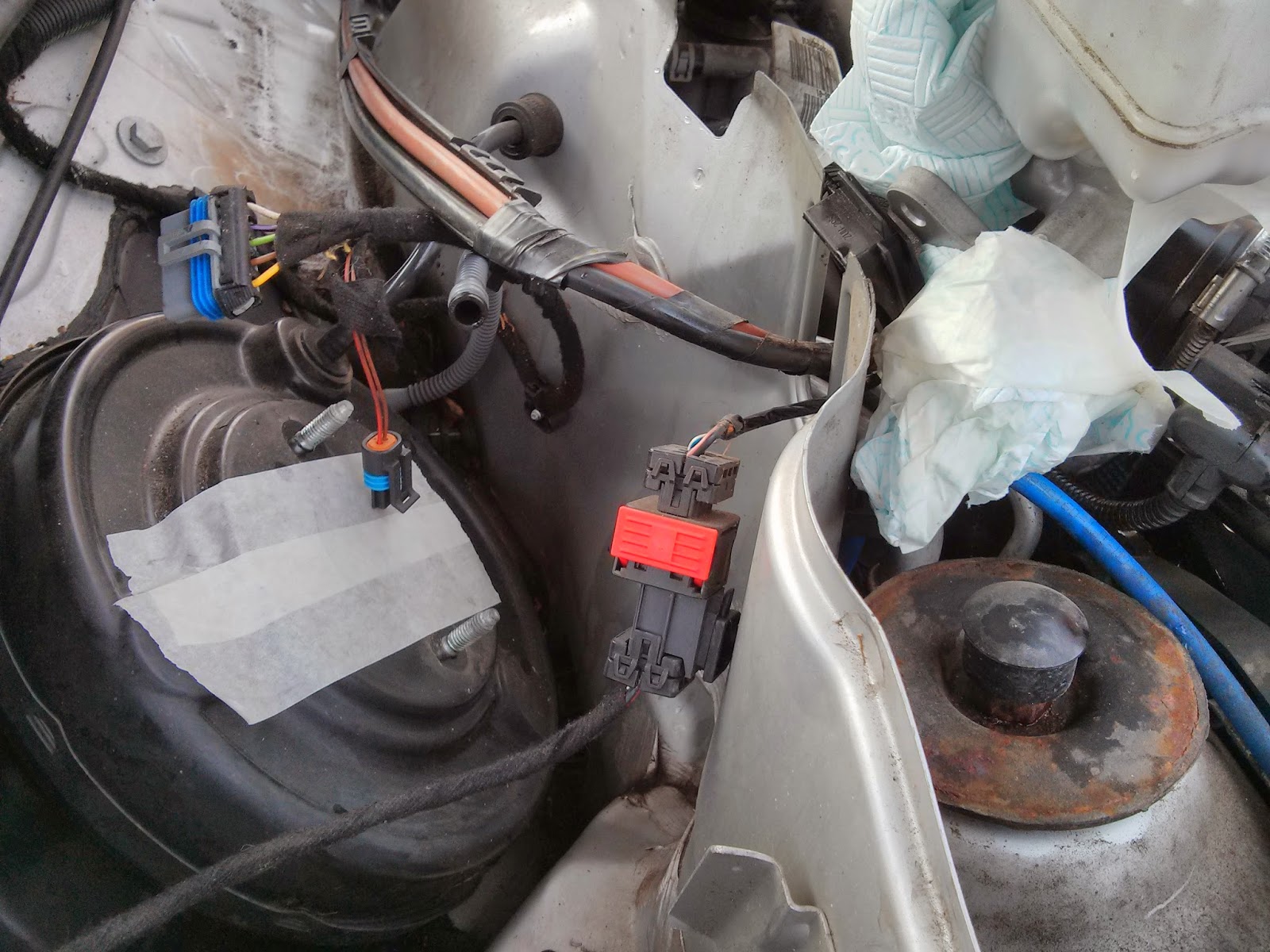 Undo the master cylinder bolts (13mm) and move it out of the way. I find it best to hold the battery cables and move it underneath.