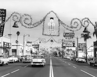 This is not really Hollywood. It's actually West Colorado Blvd. in Pasadena but the L.A. Public Library photo archive doesn't say that. 1956 Chevrolet in the foreground with a Rolls dealer to the left.