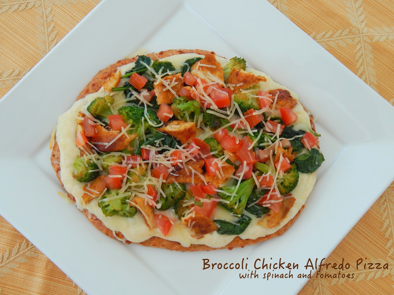 Broccoli and Chicken Alfredo Pizza with Spinach and Tomatoes Cut The