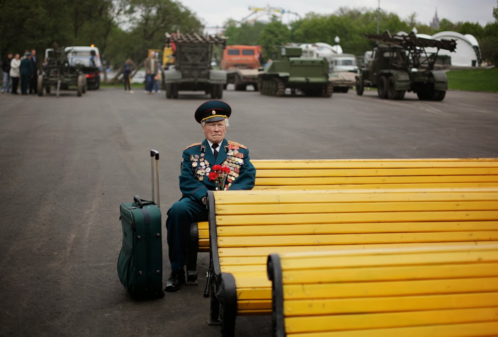 World War II veteran from Belarus Konstantin Pronin, 86, sits on a bench as he waits for his comrades at Gorky park during Victory Day in Moscow, Russia, on Monday, May 9, 2011. Konstantin comes to this place every year. This year he was the only person from the unit to show.