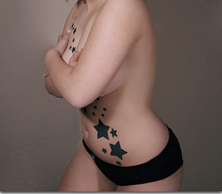 Celestial Star Tattoos Tale for Girls Hot and sexy Star tattoos tale on top of girls breast and front area of body.