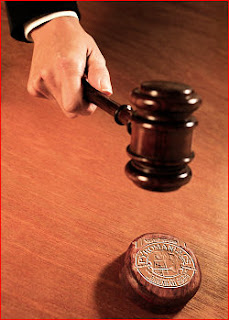 The gavel is swinging