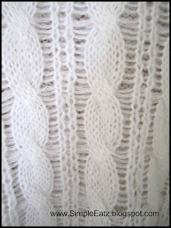 close up shot of white knitted sweater
