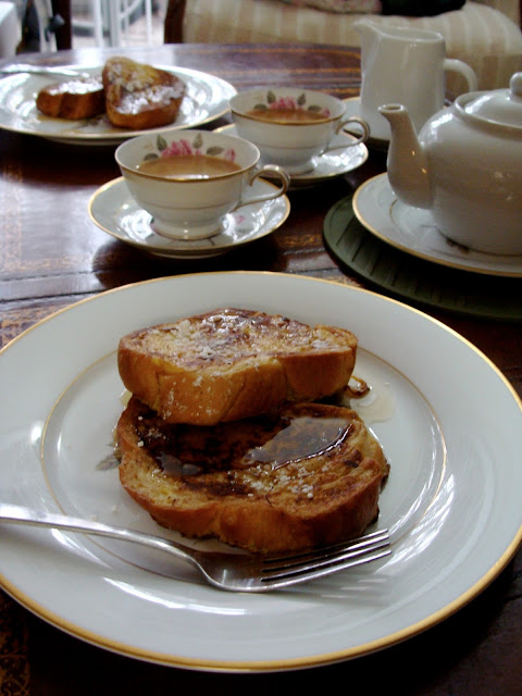 Thick Cut Challah French Toast with syrup and Breakfast Tea with cream