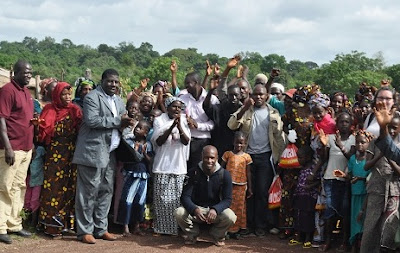 Representatives from Tostan and the Government with community members in Koobèn.