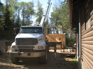 crane installing frame trusses, www.huismanconcepts.com