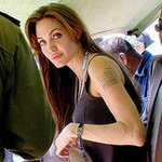 Angelina Jolie talked about her mysterious tattoo in her latest interview in US TV Show "Extra"