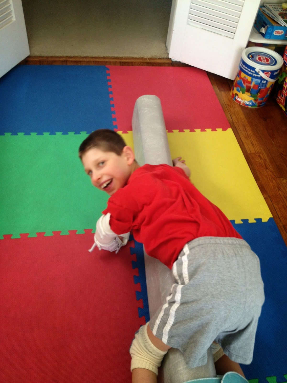 Kevin's Healing Journey Creeping with arm brace, bolster, and strap