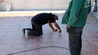 Bekir making sure they will grout the tiles Bekir making sure they will grout the tiles