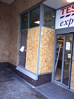 a storefront with a sign and a window