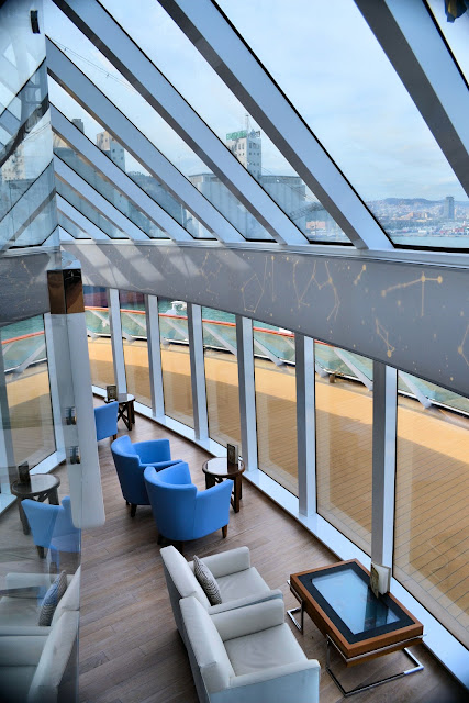 Explorer's Lounge on the Viking Star offers stunning views of the horizons ahead. Note the constellations on the band of wall between the two decks as well as the interactive coffee table at the bottom of the photo.